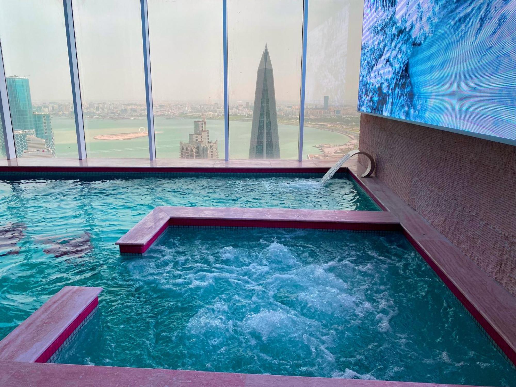 The Bentley Luxury Hotel & Suites Doha Exterior photo The swimming pool at the Ritz-Carlton, Riyadh
