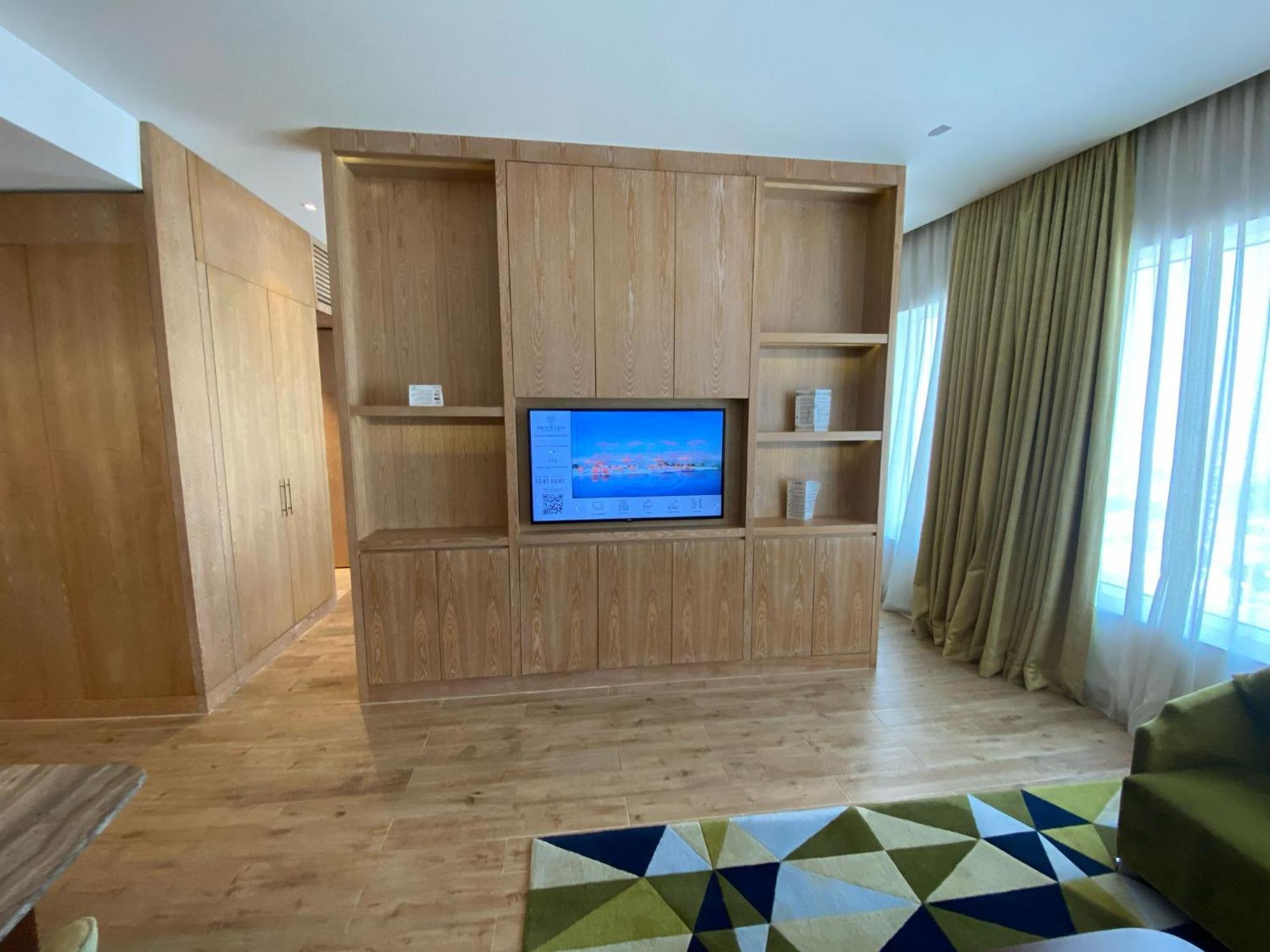 The Bentley Luxury Hotel & Suites Doha Exterior photo A television in a hotel room